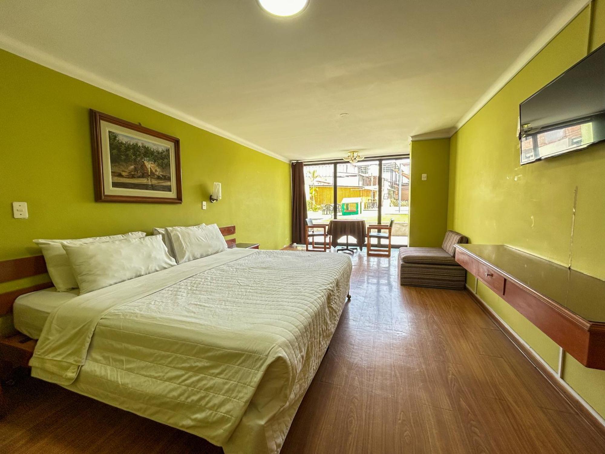 Holiday Suites Tacna Quarto foto
